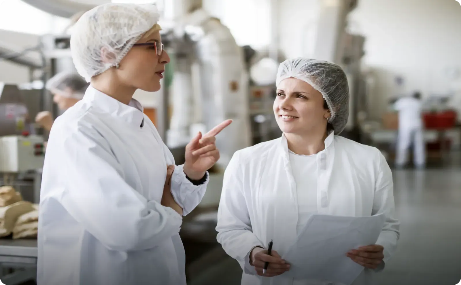 Food product development team collaborating in a production environment